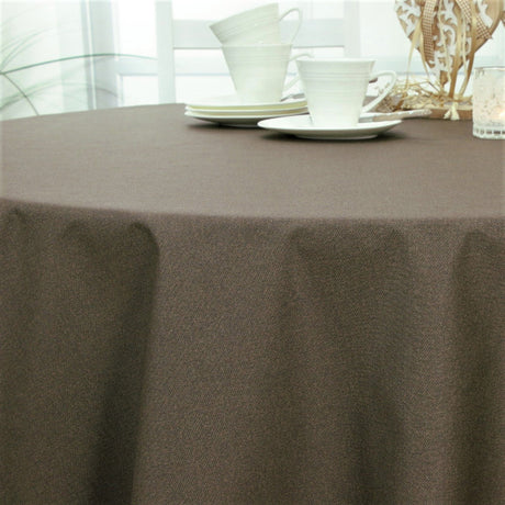 Dali Taupe – Ensfarvet tekstilvoksdug med stofstruktur – 140 cm bred, rund